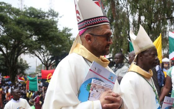 Bishop Sithembele Sipuka of Mthatha, South Africa, (left) is shown here at the opening Mass of the weeklong meeting of the Symposium of Episcopal Conferences of Africa and Madagascar in Kampala, Uganda, July 21, 2019. (CNS/Courtesy of SECAM)