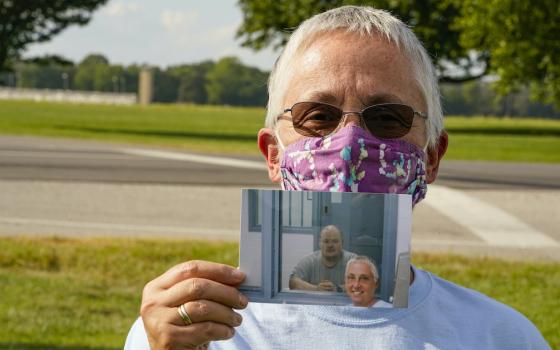 Providence Sr. Barbara Battista holds a photo taken during her last visit with Keith Dwayne Nelson, who was executed at the federal prison complex in Terre Haute, Indiana, Aug. 28, 2020. Battista was Nelson's spiritual adviser. (AP)