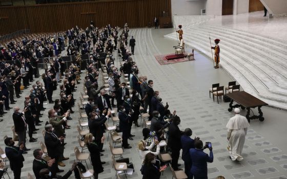 Pope Francis arrives to meet with the participants at the interparliamentary meeting on the U.N. climate conference, COP26, in the Paul VI Hall at the Vatican Oct. 9. (AP Photo/Gregorio Borgia)