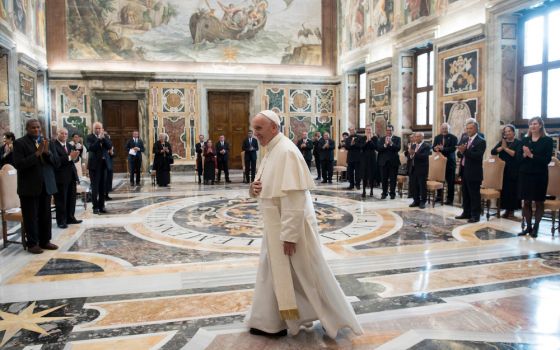 Pope Francis walks in the Clementine Hall after meeting with a delegation of Pacific leaders to discuss climate issues, at the Vatican in November 2017. Francis will be one of several world leaders to present a joint declaration to the U.N. climate confer