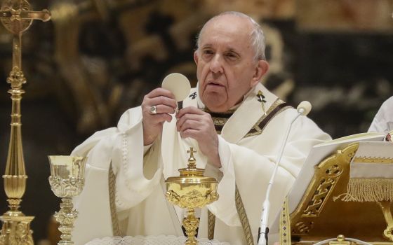 In this Feb. 2, 2021 file photo, Pope Francis celebrates a Mass with members of religious institutions in St. Peter's Basilica at the Vatican. (AP Photo/Andrew Medichini, pool)