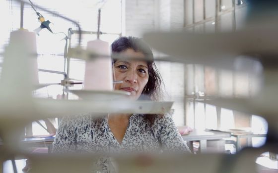 A worker sews Fashion Nova clothing in a garment factory in downtown Los Angeles on April 1, 2019. (AP/GDA via AP Images/The New York Times/Jessica Pons)