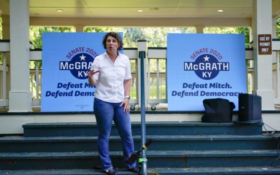 U.S. Senate candidate Amy McGrath rallies with supporters during a campaign stop at Woodland Park in Lexington, Kentucky, Aug. 25. (AP Photo/Bryan Woolston)