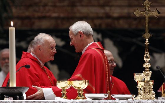 Cardinal Donald Wuerl of Washington, D.C., right, greets then-Cardinal Theodore McCarrick, retired archbishop of Washington, during the sign of peace at a Mass of thanksgiving in St. Peter's Basilica at the Vatican Nov. 22, 2010. (CNS/Paul Haring) 