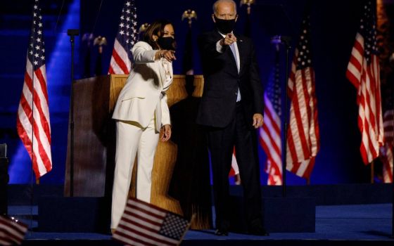 Democratic presidential nominee Joe Biden, right, joins vice presidential nominee Kamala Harris onstage at a rally in Wilmington, Delaware, Nov. 7, after news media declared they had won the presidential election.(CNS/Reuters/Jim Bourg)