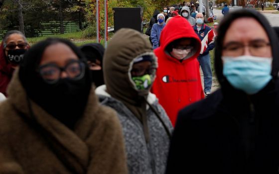 People in Cleveland wait in line to cast early in-person votes Oct. 24. (CNS/Reuters/Shannon Stapleton)