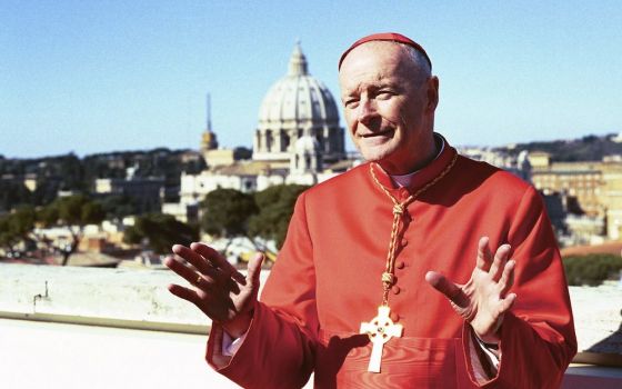 As a newly created cardinal, Theodore McCarrick addresses the media on the roof of the North American College in Rome following a consistory ceremony at the Vatican Feb. 21, 2001. (CNS/Carol Zimmermann)