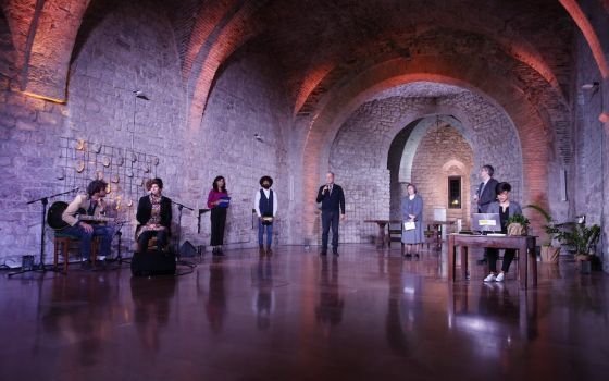 People participate in the "Economy of Francesco" virtual meeting Nov. 21. Organizers were situated in the Basilica of St. Francis of Assisi in Assisi, Italy. (CNS/Economy of Francesco)