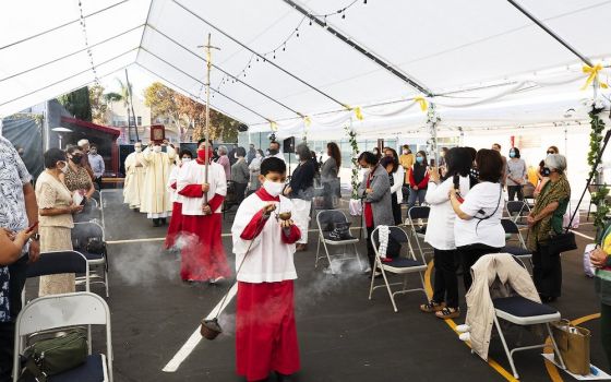 Fr. Juan Ochoa, administrator of Christ the King Church near Hancock Park, California, processes during the opening Mass Nov. 22, 2020. (CNS/Angelus News/Victor Aleman)