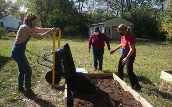 People work on a garden at Sacred Heart Parish Mission in the Diocese of Joliet, Illinois. The food grown will be distributed to people in need of food assistance in the community. (CNS/Courtesy of the Diocese of Joliet, Illinois)