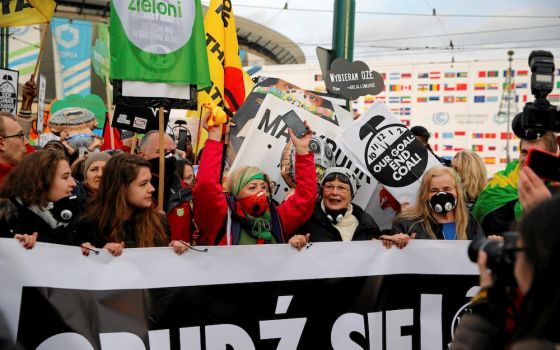 Protesters march outside the venue of the U.N. climate change conference, or COP24, Dec. 8, 2018, in Katowice, Poland. (CNS/Reuters/Kacper Pempel)