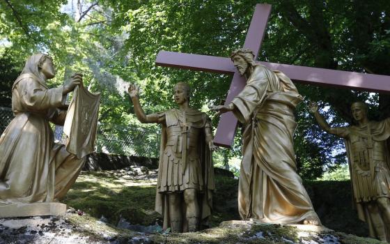 Veronica wipes the face of Jesus in this representation of the sixth Station of Cross at the Shrine of Our Lady of Lourdes in southwestern France. (CNS/Paul Haring)