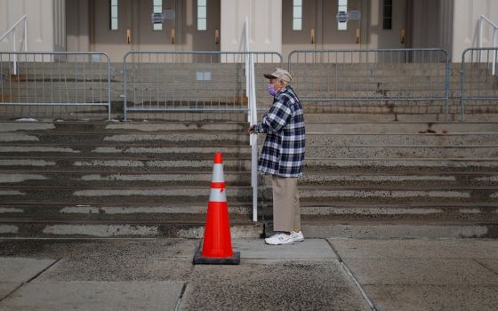 An elderly man in White Plains, New York, waits in line to receive a COVID-19 vaccine Feb. 23, 2021. (CNS/Reuters/Mike Segar)