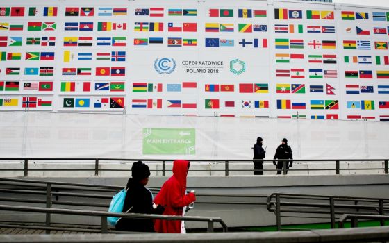 People walk past the International Congress Center during COP24, the U.N. climate change conference in Katowice, Poland, Dec. 3. (Sipa USA/NurPhoto/Mateusz Wlodarczyk) 