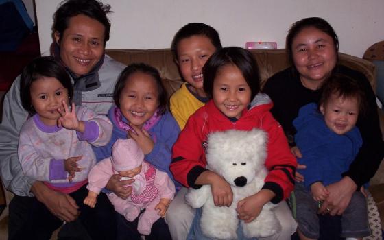 The Burmese family mentored by Sr. Margaret Cessna after a visit to the health clinic. (Courtesy of Margaret Cessna)