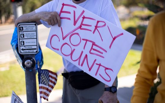 On climate issues, every vote counts at state and local level, as well as in national elections. (CNS photo/Mike Blake, Reuters)