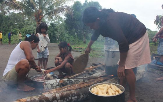 Urarina women prepare breakfast in Santa Lucía, on the Urituyacu River in northeastern Peru. (NCR photo/Barbara Fraser)