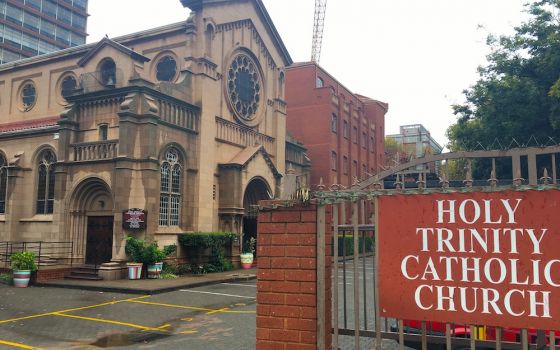 View of Romanesque style church with sign