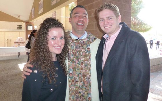 Kimberly Roland standing with Fr. Andrés Arango and her now husband Brendan Brady outside St. Jerome Parish in Phoenix, from around 2012-13 (Courtesy of Kimberly Roland)