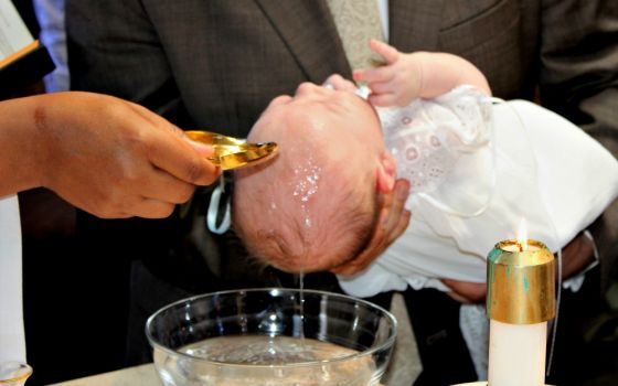 The baptism of George DeSales Piper on Oct. 1 at St. Barnabas Parish in Chicago (Provided photo)