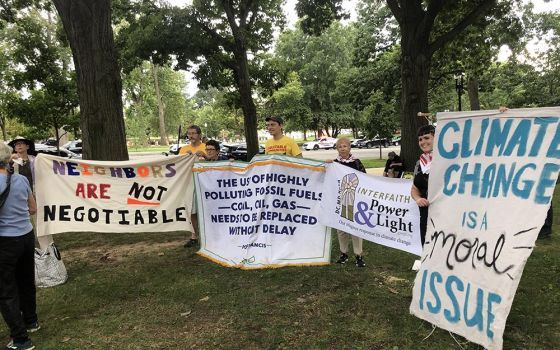 Representatives of faith groups hold banners for a group picture at the "No Sacrifice Zones: Appalachian Resistance Comes to D.C." rally on Sept. 8 in Washington, D.C. (EarthBeat photo/Aleja Hertzler-McCain)