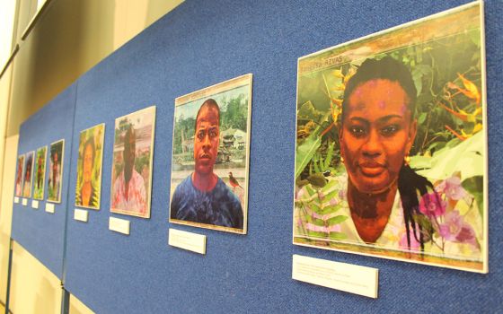 Guardians of the Atrato River are featured in digital portraits during a Nov. 3 event at the University of Glasgow. (NCR photo/Brian Roewe)