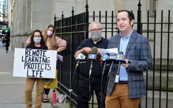 James Cahill, 32, a middle school social studies teacher at St. Francis Xavier School in Wilmette, Illinois, speaks out against the Chicago Archdiocese's reopening plan at a rally in front of schools' headquarters in downtown Chicago on Aug. 20. (Courtesy