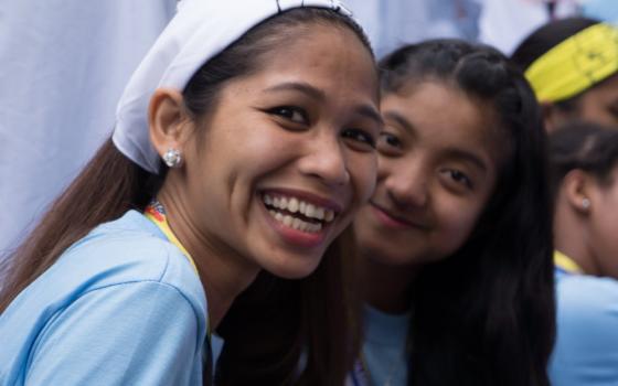 Smiling Jane Ollivier with another younger girl