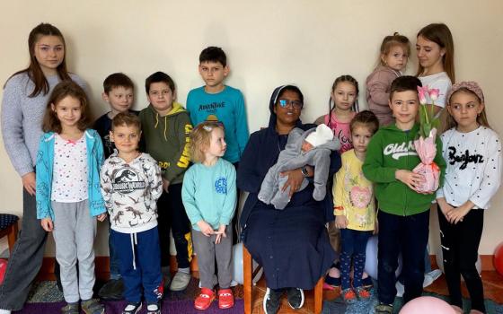 Sr. Ligi Payyappilly, a member of the Sisters of St. Joseph of Saint-Marc, with children sheltering in her convent in Mukachevo, a town in western Ukraine, following the Russian invasion Feb. 24.