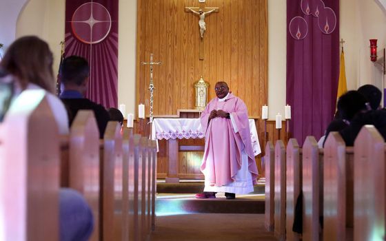 Fr. Athanasius Abanulo celebrates Mass at Holy Family Catholic Church in Lanett, Alabama, on Sunday, Dec. 12, 2021. (AP/Jessie Wardarski)