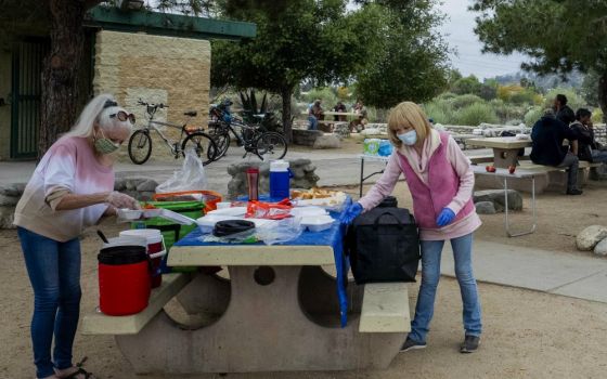 Mater Dolorosa volunteers prepare to serve people experiencing homelessness in Lario Park in Azusa, California. (Michael Cunningham, OSF)