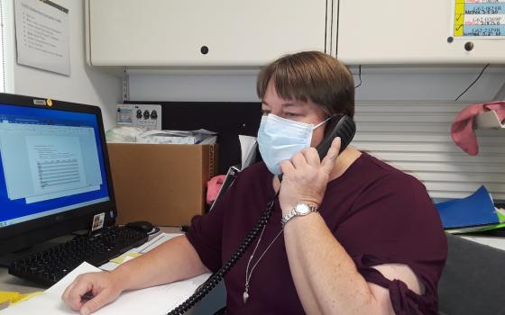 Sr. Michelle Woodruff of the Adorers of the Blood of Christ calls contacts of people who have tested positive for COVID-19 in April. She is a public health nurse at Crownpoint Health Care Facility in New Mexico. (Provided photo)