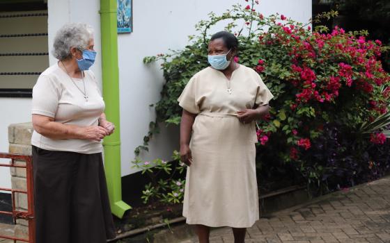 Sr. Miriam Duggan, left, interacts with another sister at Cheshire home for the elderly in Kariobangi slum in outside Nairobi, Kenya. (Doreen Ajiambo)