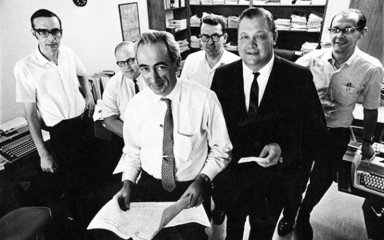 Tom Blackburn, is pictured, back row, left, next to James Andrews, Art Winter and Robert Olmstead, behind NCR editor Robert Hoyt and publisher Donald Thorman (NCR file photo)