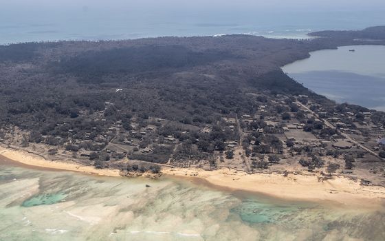 Heavy ash fall from a Jan. 15 volcanic eruption is seen in an aerial photo of Tonga Jan. 17. (Wikimedia Commons/New Zealand Defence Force)