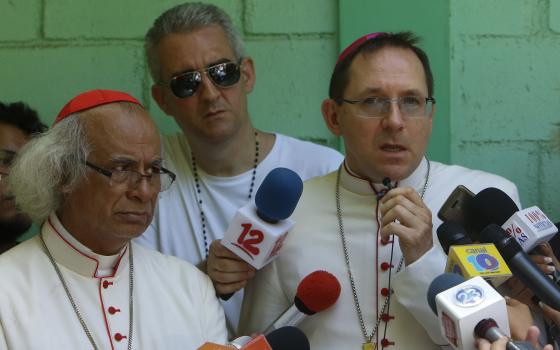 Archbishop Waldemar Stanislaw, right, speaks with journalists accompanied by Cardinal Leopoldo Brenes, at the Cathedral in Managua, Nicaragua, July 14, 2018. (AP Photo/Alfredo Zuniga, File)