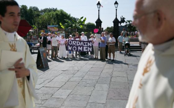 Supporters of women's ordination gather in Jackson Square in New Orleans outside the St. Louis Cathedral during the archdiocese's ordination ceremony for new priests in June 2015. (Gabriela Arp)