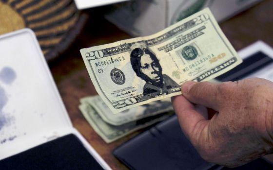 A U.S. $20 bill from the offering plate at Hope Central Church in Boston is stamped with the face of abolitionist Harriet Tubman on June 2. (RNS/Aysha Khan)