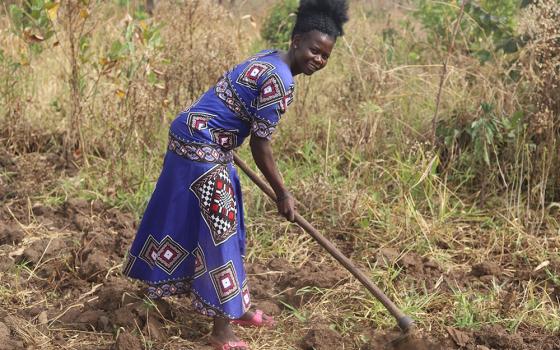 Rose Geno, 30, tills her land in preparation for the next planting season, which began in March. With the skills and support she received from Sr. Lucy Akera and Salesian missionaries, she hopes to increase her harvest. Geno started farming to mitigate fo