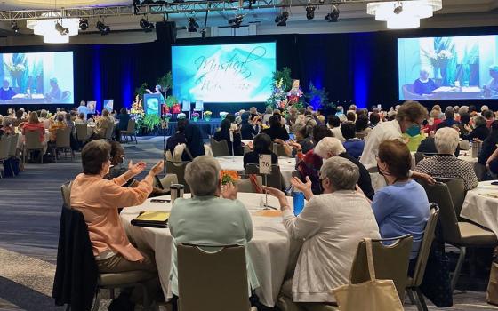 Attendees pray with theologians Baltimore Carmelite Sr. Connie FitzGerald and M. Shawn Copeland Aug. 10 at the Leadership Conference of Women Religious Assembly in St. Louis. (GSR photo/Sr. Helga Leija)