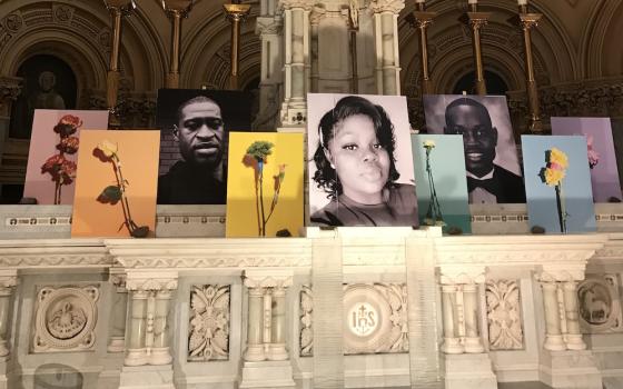 Past view of altar of St. Francis Xavier Church, with photograph of George Floyd, Breonna Taylor and Ahmaud Arbery (Courtesy of St. Francis Xavier Church)