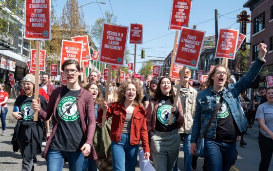 Starbucks workers march for the right to organize a workers' union on April 23 in Seattle. (Wikimedia Commons/elliotstoller)