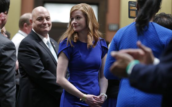 Michigan state Sen. Mallory McMorrow, center, is shown at the state capitol before the State of the State address, Jan. 29, 2020, in Lansing, Michigan. (AP photo/Al Goldis)