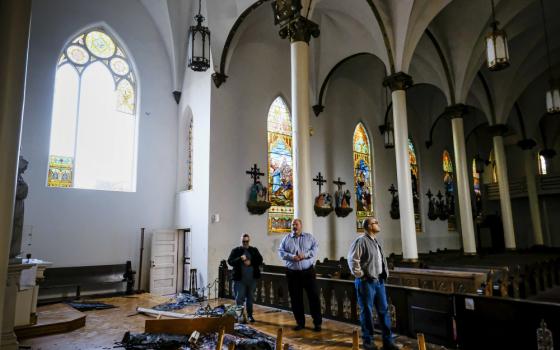 People look over the damage to the Church of the Assumption following a March 3 tornado in Nashville, Tennessee. (CNS / Tennessee Register / Rick Musacchio)