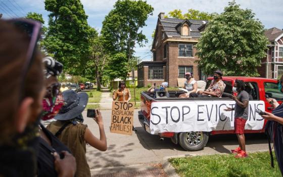 Tristan Taylor of Detroit speaks to people gathered June 9, 2020, during a caravan protest through Detroit neighborhoods while calling for relief for tenants and mortgage borrowers during the coronavirus pandemic. (CNS/USA Today Network via Reuters/Ryan G