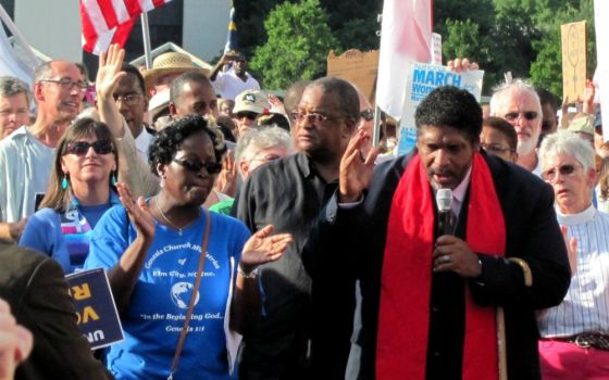 In this 2013 file photo, the Rev. William Barber speaks at a Moral Mondays rally in North Carolina. (Wikimedia Commons/twbuckner)