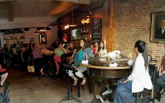 Four panelists speak at a Theology on Tap presentation on women in the church hosted by St. Procopius Parish in Pilsen, Chicago in summer 2017. (Mark Piper)