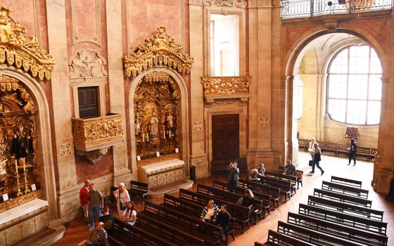 People are seen in Igreja dos Clérigos ("Church of the Clergy") in Porto, Portugal, in January 2019. (Dreamstime/Ksenija2015)