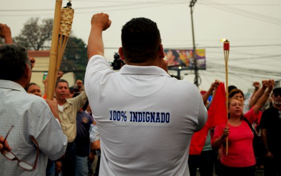 People march April 26 in Tegucigalpa, Honduras, protesting corruption and the government of President Juan Orlando Hernández. (Dreamstime/Herbert Soriano)