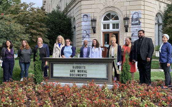 Faith leaders and staff gather in prayer and reflection Sept. 23 in front of the United Methodist Building in Washington to call on lawmakers to push for the $3.5 trillion human infrastructure bill. (NCR/Melissa Cedillo)